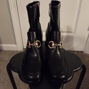 Elegant Black Ankle Boots with Gold Accents